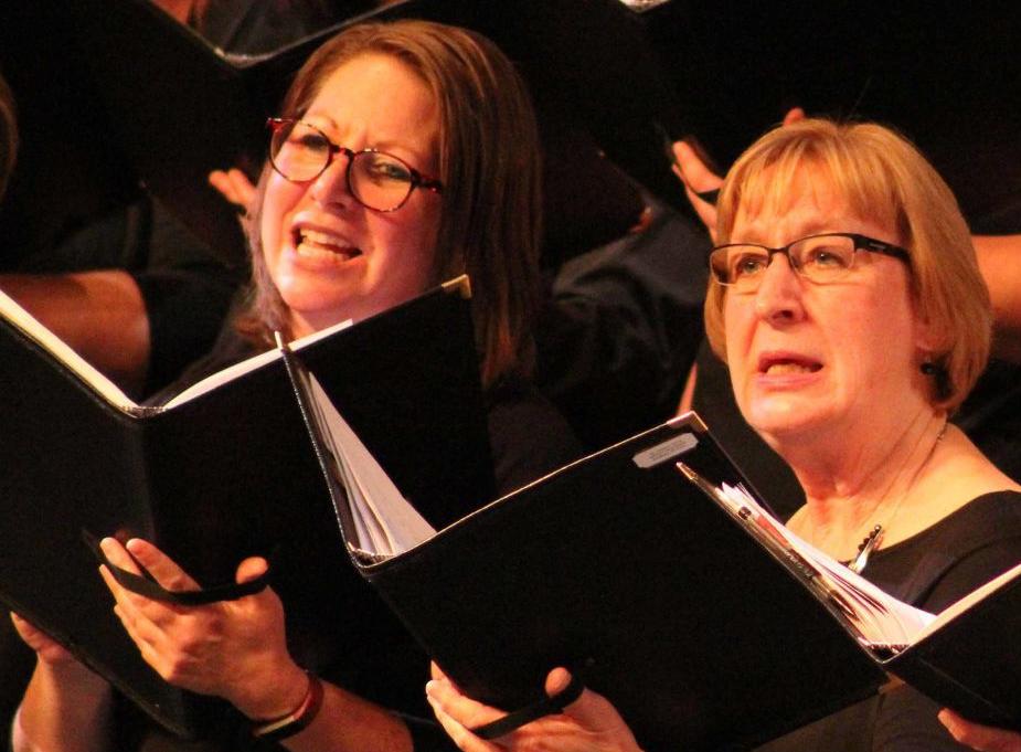 Choir members sing